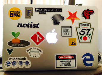 Laptop back with lots of stickers